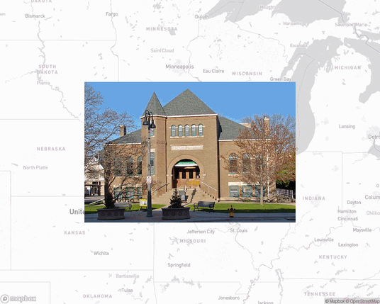 A photo of or from a library from the linked website, overlaid on a cropped world map where it's located.
