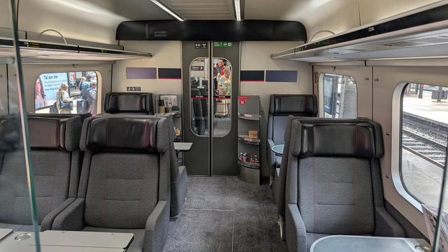 Spacious seat arrangement in an IC MF trainset with bold armchairs.