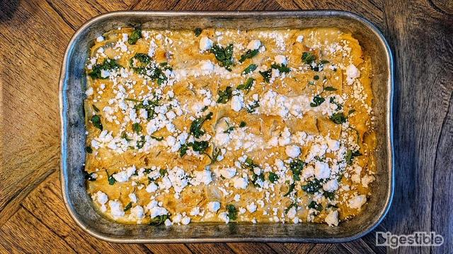 Thai Green Curry enchiladas in a metal pan on a table from the top down.