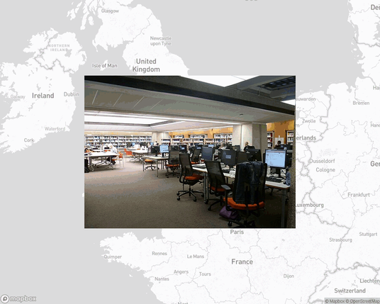 A photo of or from a library from the linked website, overlaid on a cropped world map where it's located.