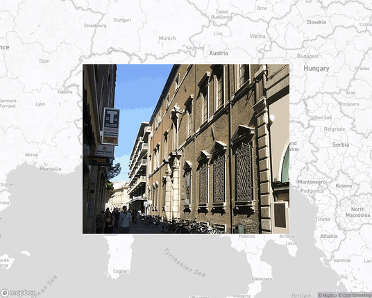 A photo of or from a library from the linked website, overlaid on a cropped world map where it's located.