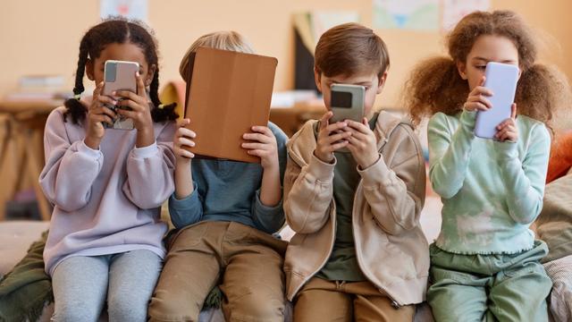 Children using mobile devices