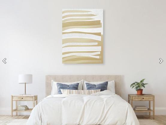 Clean white brush strokes on tan abstract painting in a bedroom furniture setting. Art by Sharon Cummings.