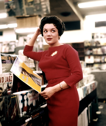 promo photoshoot of Connie shopping in a record store at early peak of her fame