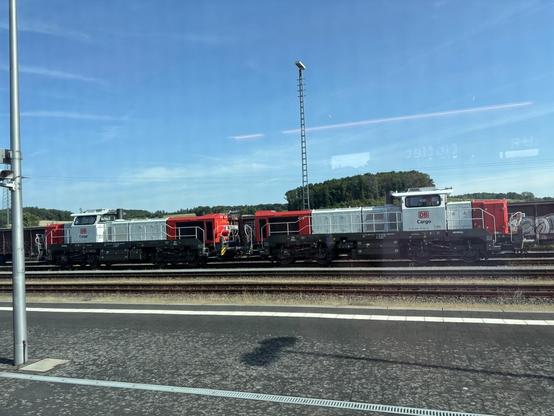 photograph of two DB Cargo shunter locomotives coupled together and moving on a track
they are face to face