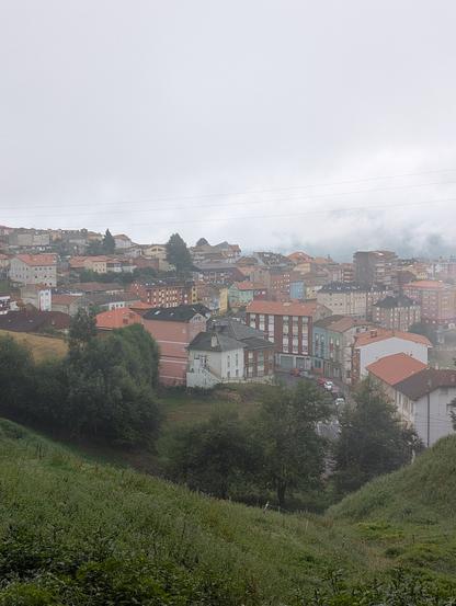 A foggy sky over the town of Tineo