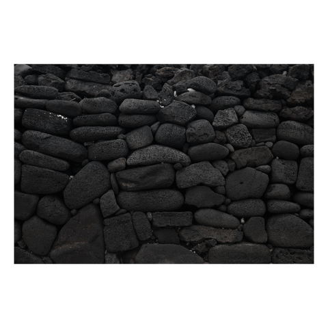 stacked lava stone wall at sacred site in hawaii