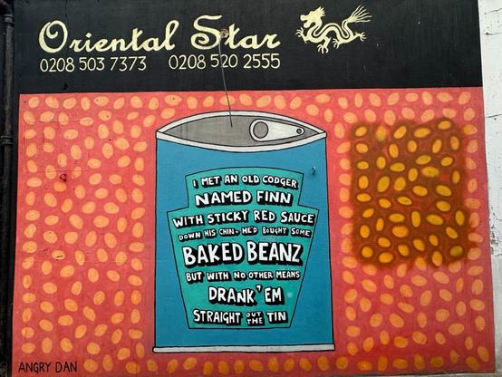 A mural of a stylised tin of baked beans, with the label reading “I met an old codger named Finn with sticky red sauce down his chin, he’d bought some baked beanz, but with no other means, drank ‘em straight out the tin”