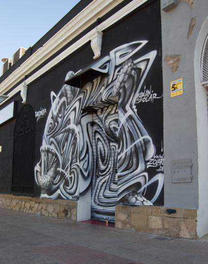 mural streetart by fabian zolar in sabadell barcelona, streetart on old building in sabadell spain by streetartist fabian zolar