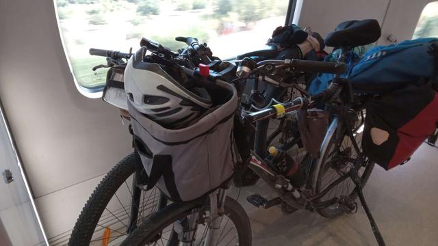 two loaden bicycles in a train