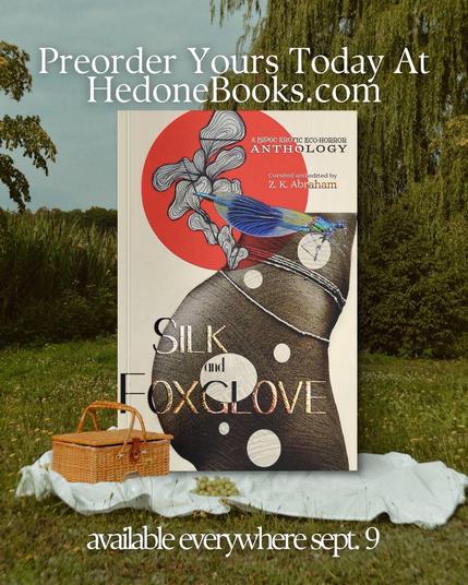 An outdoor setting featuring a picnic basket and a blanket. Prominent in the foreground is a book cover titled "Silk and Foxglove," with artistic illustrations and text announcing a preorder at HedoneBooks.com