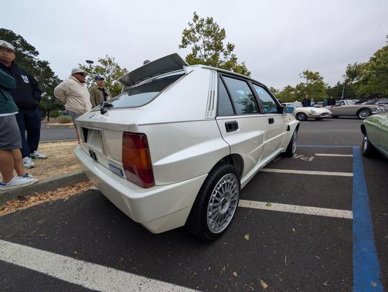 Rear 3/4 view of a white Lancia Integrale Evo