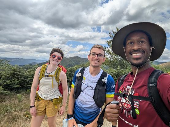 Me with two friends: one from the group, one who we became acquainted with on the trail. Mountains in the background