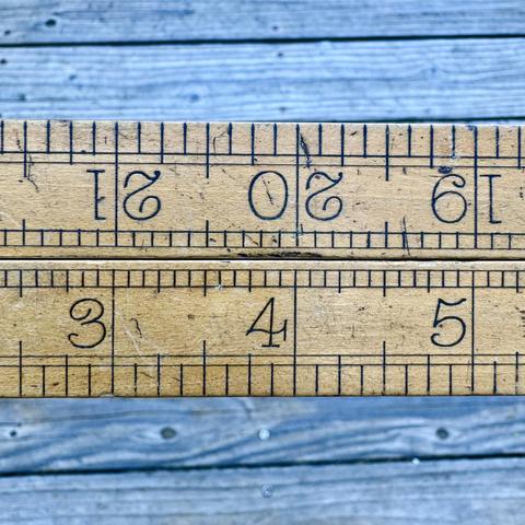 vintage folding brass and boxwood rule - showing two closed arms side by side, with 3,4,5 on the bottom and upside down 19,20,21 inch marks on the top