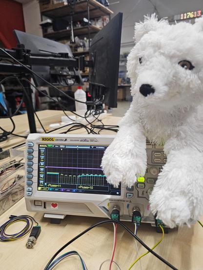 An oscilloscope, which shows items “+Pulses” and “-Pulses” as labels of the buttons on the left side of the screen. On the bottom, there are two measure items shown: “-Pluses” and “+Pluses”