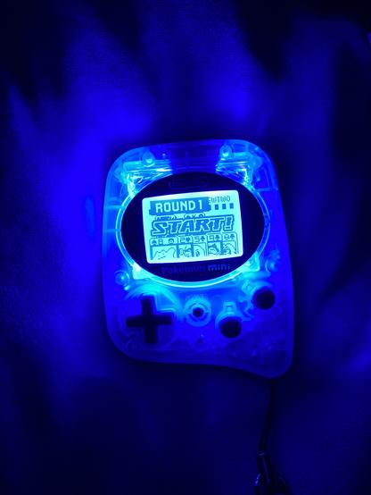 A backlit Pokemon Mini console I bought on Ebay, playing a round of Zany Cards with Mewtwo.