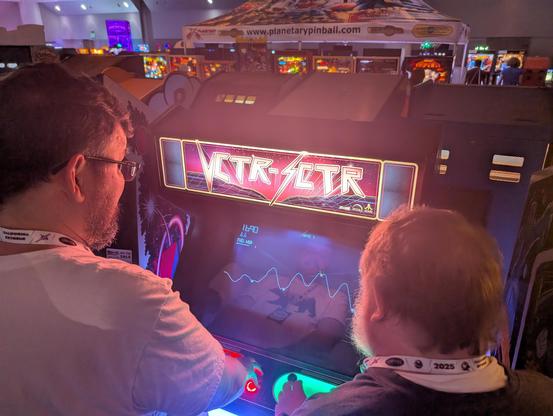 Karwood and Brophey playing the Lunar Lander section of Vctr-Sctr