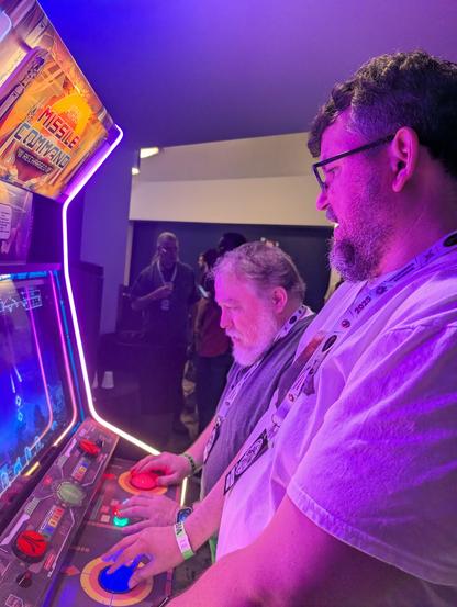 Karwood and Brophey playing Missile Command Recharged