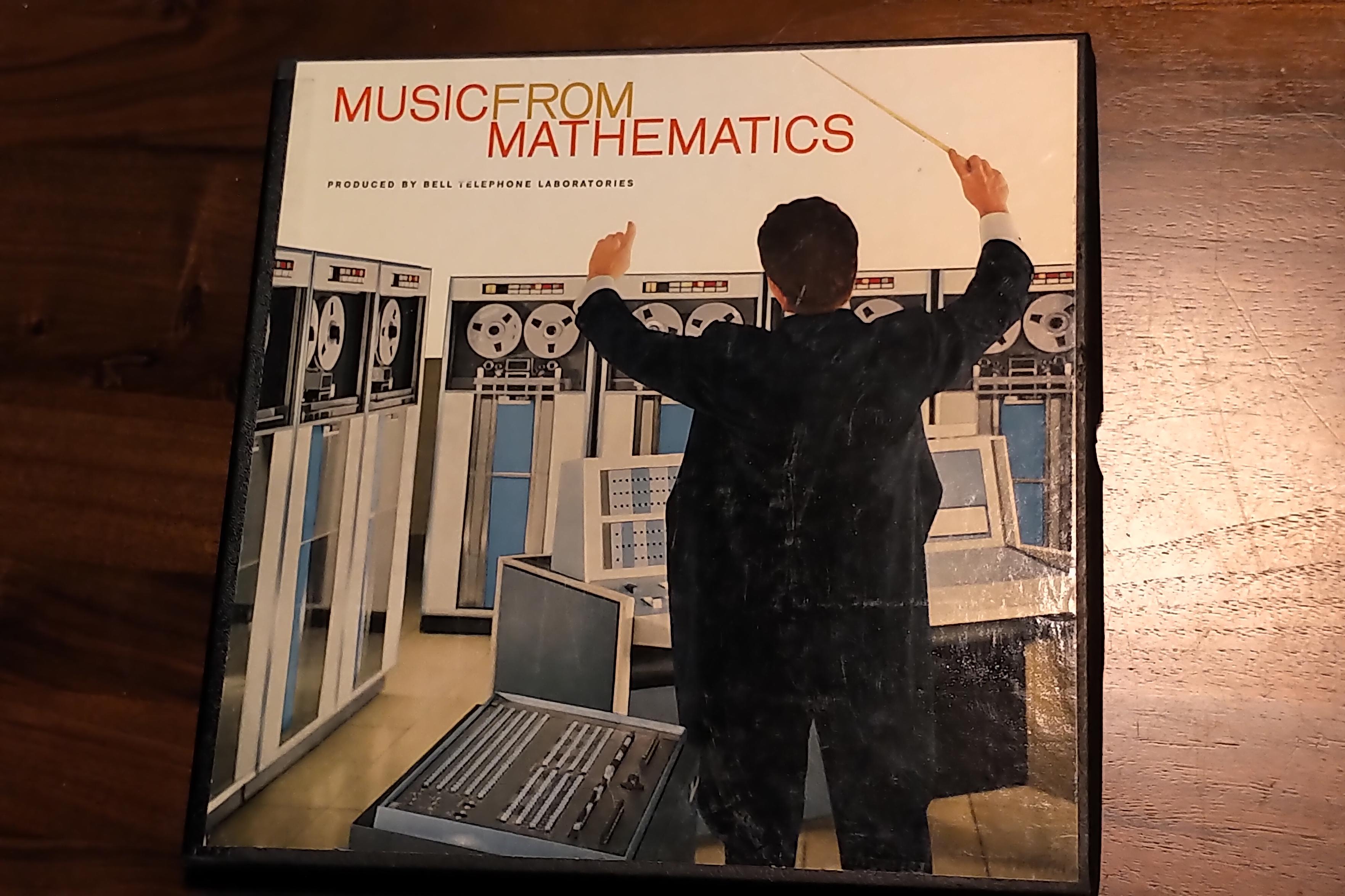 Box set "Music from Mathematics" . Features an IBM 7090 and 704, with a conductor in front of them