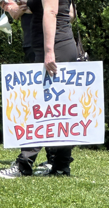 Internet snippet of a Canadian protest poster saying "Radicalised by basic decency"