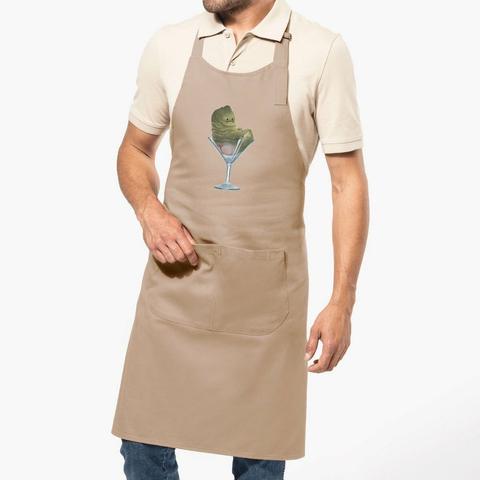 Apron with a little fat green monster on the front sitting in a martini glass with his little pink bottom showing