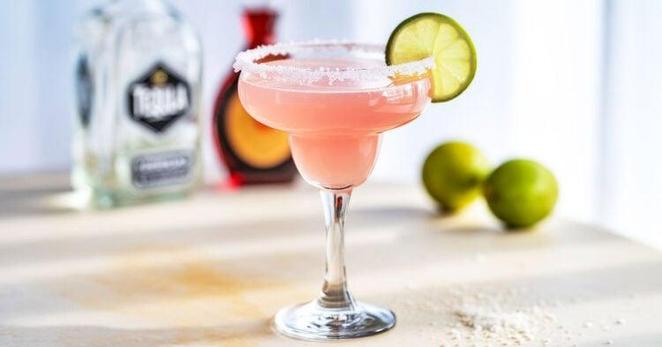 Pink Margarita drink with salt rim