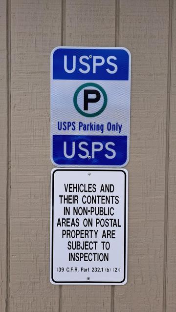 A sign posted outside a US post office.

https://www.law.cornell.edu/cfr/text/39/232.1