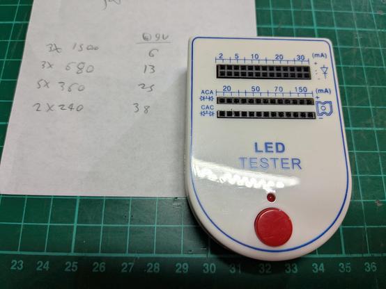 typical aliexpress led tester, small box with a number of header sockets for inserting LEDs and different slot groups are marked with different current options.