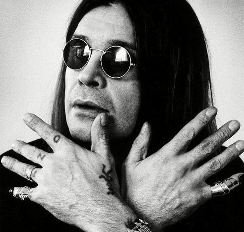 Ozzy Osbourne in his iconic round sunglasses
(black and white photo)
