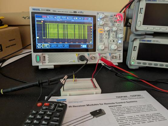 An oscilloscope displaying a active-low pulse-width modulated signal from an infrared receiver module.