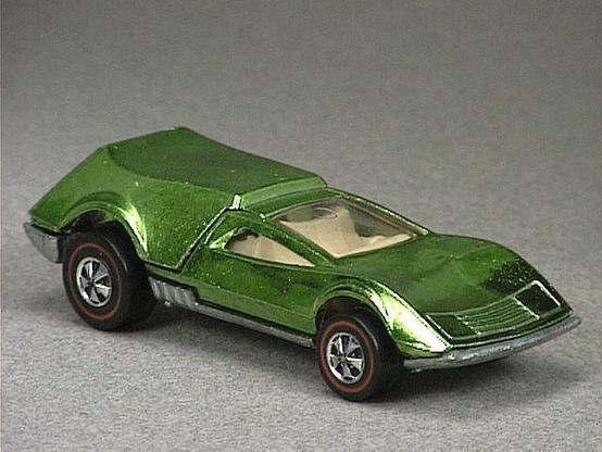 Released in 1970, Spectraflame Light Green Tri Baby of 1970 Hot Wheels with Redline wheels. Notes: Rear engine cover lifts up to reveal engine block. Packaging: 1970 Blister. Metal Body, Metal Base. Made in USA. Scarcity: 3/10