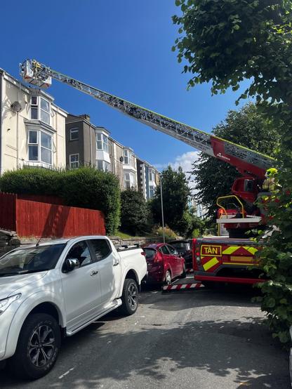 Firefighters from Morriston Fire Station used a specialist turntable ladder — and cat treats — to rescue a feline stranded on a three-storey rooftop in Brynmill, Swansea