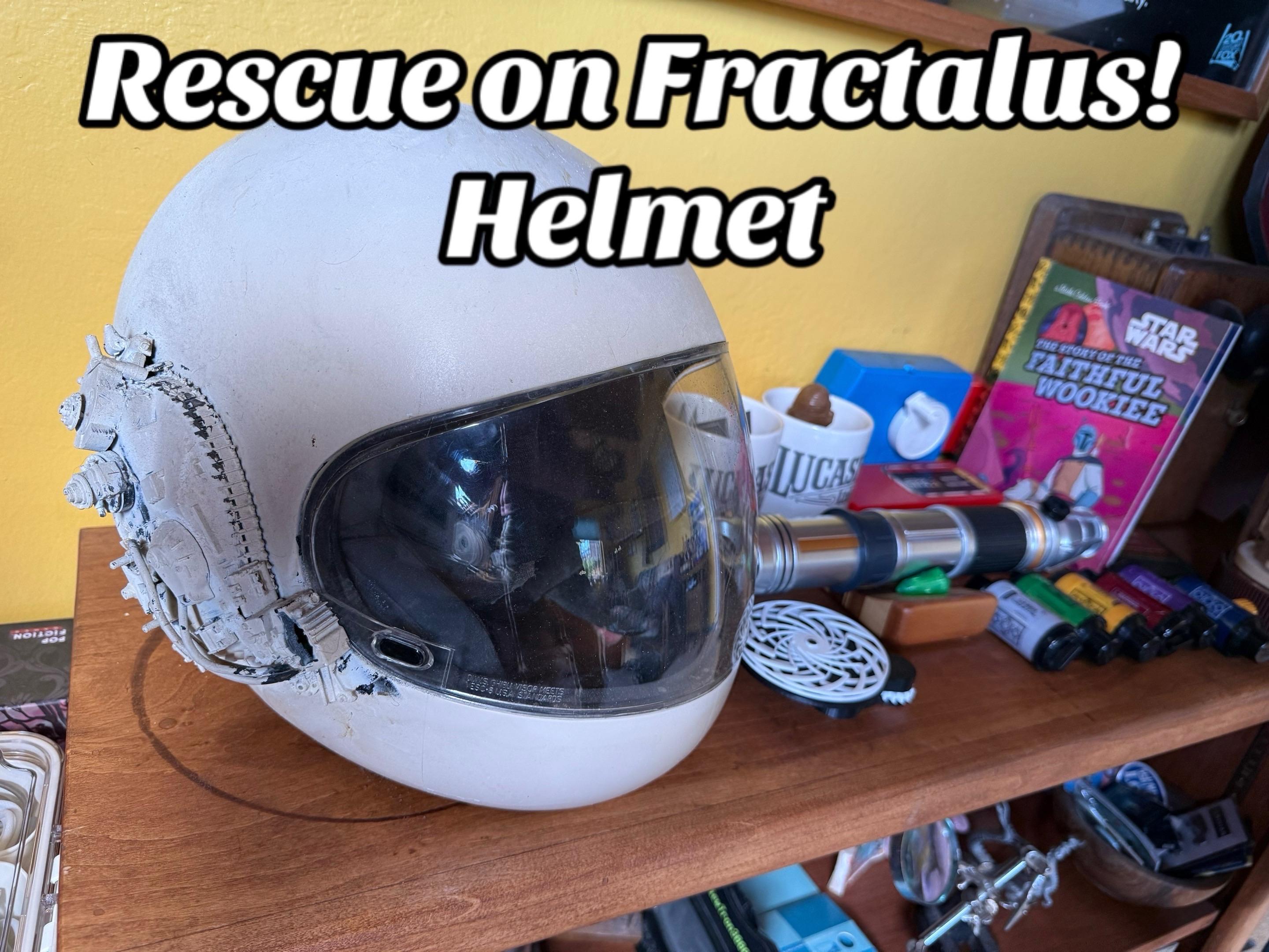 Rescue on Fractalus! pilot helmet, modified with model tank turrets on the side. Also a lightsaber and Kyber crystals, a Lucasfilm mug.