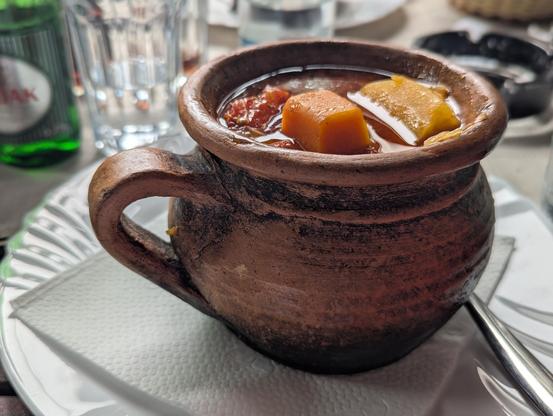 A Bosnian pot with meat, carrot, potatoes, tomato, and whatnot