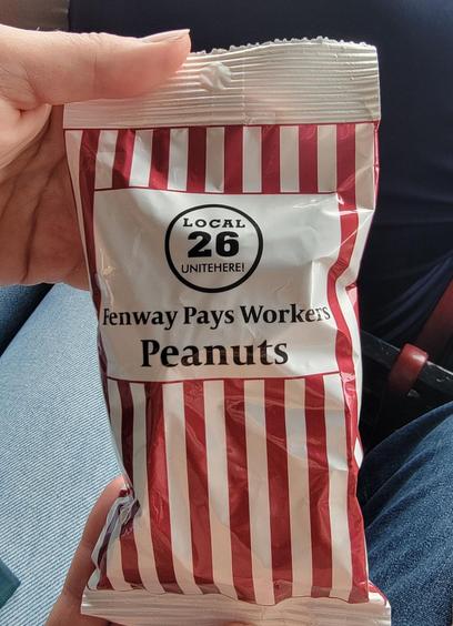 sealed bag labeled "Local 26, UNITE-HERE, Fenway pays workers PEANUTS"