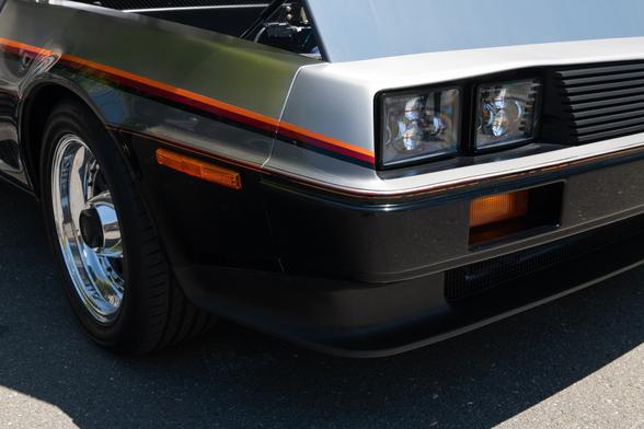 A close up of the headlights area. New LED retrofits have been put in place of the original rectangular sealed beam units. The tricolor stripes go from the headlights down the rest of the body.