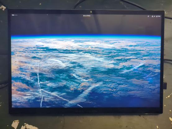 Fixed device displaying a view of earth as my desktop background.
