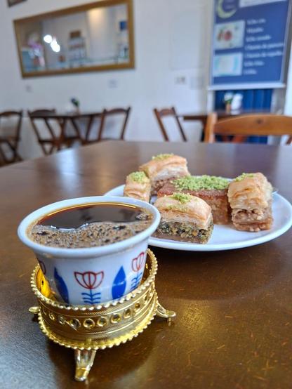 Table in a Lebanese cafe with arab coffee and sweets