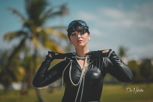 SJ Slays as Catwoman adorned in shiny Jewelry.