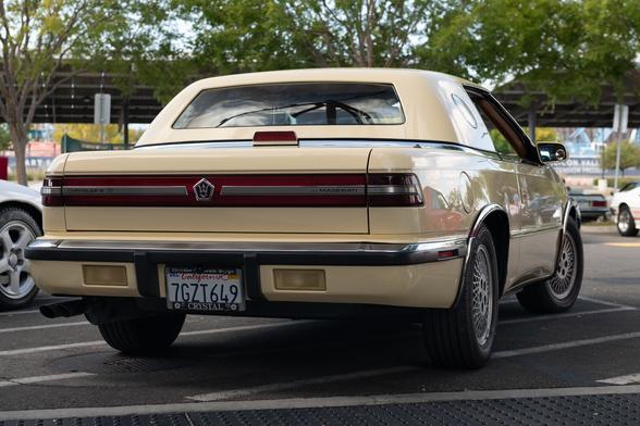 Rear view. There is a red “light bar” across the rear, and a large window in the hardtop. Port windows are seen on the sides of the hardtop.