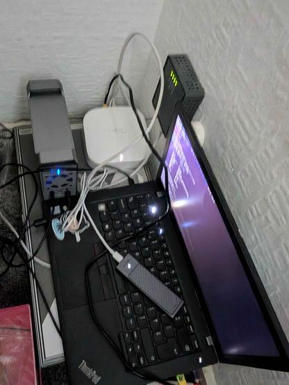 picture of my chaotic homelab

A compact homelab setup featuring a ThinkPad T480 laptop resting on an old laptop box for airflow. Nearby is a dual-bay external HDD enclosure connected via USB, an external NVMe SSD in a sleek enclosure, and a white eero mesh Wi-Fi node with an Ethernet cable plugged in. A legacy DSL filter brick is mounted on the wall. Cables are loosely arranged around the devices, highlighting a practical, DIY personal homelab setup.