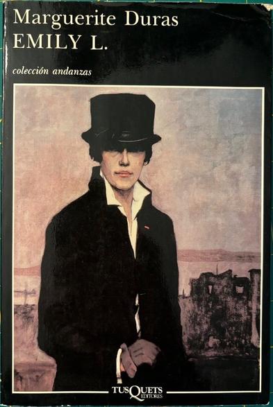 A photo of a vintage 80s paperback Spanish edition of the Margureite Duras' novel, Emily L. Inset photo is a painting a woman clad in early 20th century period black suit and hat and gloves. The hat is pulled down so that her eyes are set in deep shadow, are only vaguely visible.