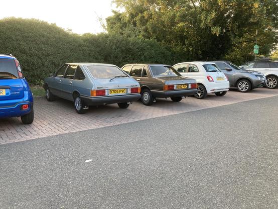 Blue Talbot Alpine and brown Talbot Solara, rear-quarter view