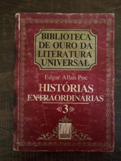 Livro de bolso antigo e gasto com uma capa vermelha marcada pelo Tempo. Título: Biblioteca de ouro da literatura universal. Edgar Allan Poe. Histórias extraordinárias 3.