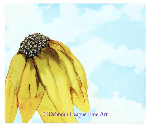 Single yellow sunflower silhouetted against a cloudy blue sky.  Nothing can lift your spirits quite like a sunflower; warm and inviting, bright and cheerful.
Did you know their yellow petals are also known as rays? Their unmistakable sun-like appearance has made them a guaranteed people pleaser.