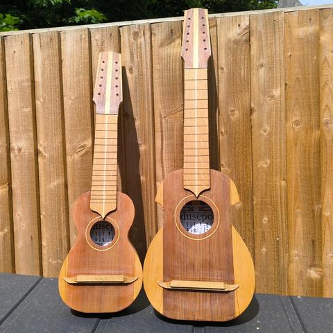 A charango and a ronroco under construction, front view
