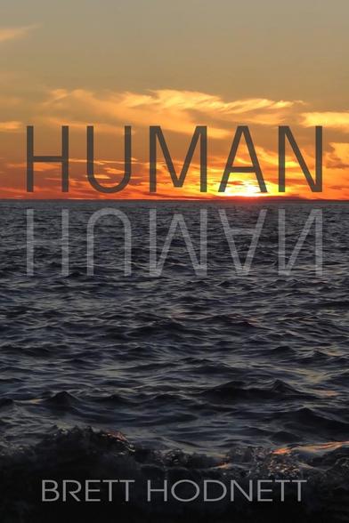 Image of the book cover of the novel HUMAN. The entire cover is a fiery orange sunset over dark, choppy water. The bottom two-thirds of the image is the dark waters, the top third is an orange sky and sparse clouds lit by a fiery orange sun two-thirds below the horizon. Printed in large dark letters just above the horizon line is the word HUMAN in capital letters. The inverse of the word HUMAN is reflected in light grey in the water below. At the very bottom of the page the water curls in a slight wave and printed over that in smaller grey letters is the authors name, Brett Hodnett, in capital letters.
