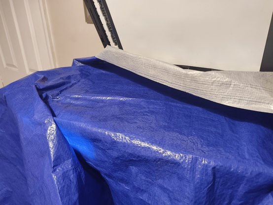 A tarpaulin sheet on a scanner