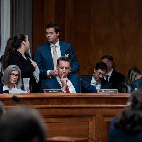 Senator Josh Hawley, center in a red tie, gained support from Democrats for a bill he sponsored.