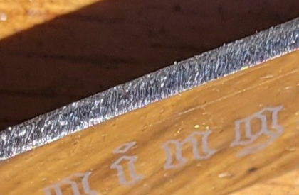 Flat blade with no pitting, fresh metal and not rounded. Still a few burrs visible.